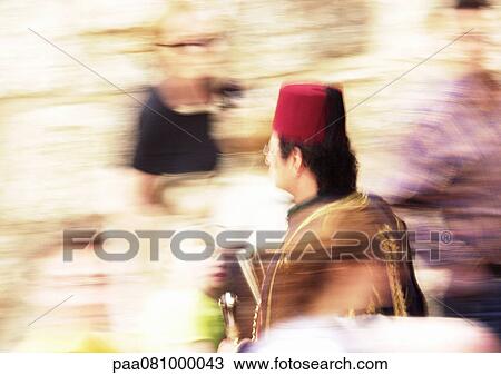 Stock Image - Israel, Jerusalem, man in decorative garments, blurry.. Fotosearch