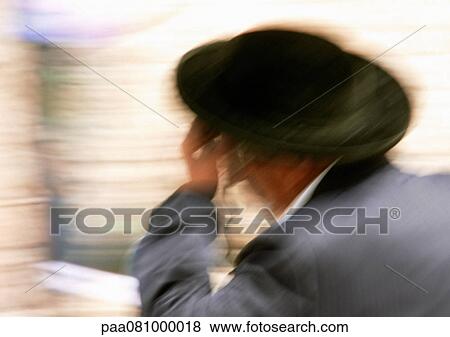 Stock Photo - Israel, Jerusalem, Orthodox Jewish man, blurred. Fotosearch