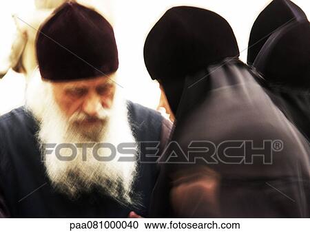 Israel, Jerusalem, Orthodox priest and nun, close-up, blurry. View Large Photo Image Stock Image - Israel, Jerusalem, Orthodox priest and nun, close-up, blurry.. Fotosearch