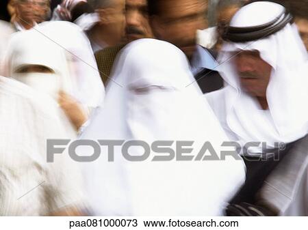 Stock Image - Israel, Jerusalem, veiled women in crowd, close-up. Fotosearch