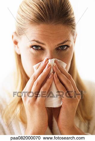 Woman blowing nose, close-up View Large Photo Image Stock Image - Woman blowing nose, close-up. Fotosearch