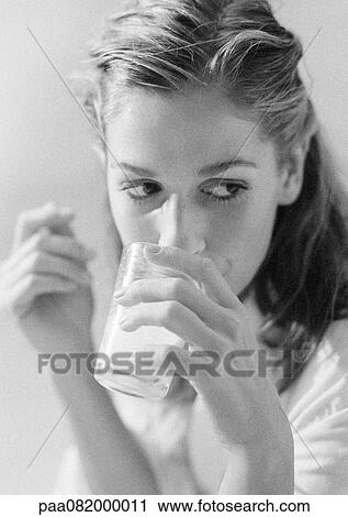 Woman drinking, B&W. View Large Photo Image Stock Image - Woman drinking, B&W.. Fotosearch