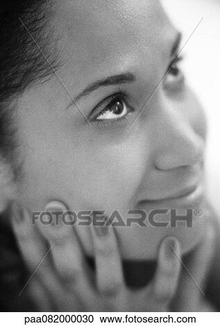 Woman holding face with hands, looking up, close-up, B&W. View Large Photo Image Stock Image - Woman holding face with hands, looking up, close-up, B&W.. Fotosearch