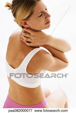 Woman in underwear holding neck, waist up. View Large Photo Image Stock Photo - Woman in underwear holding neck, waist up.. Fotosearch