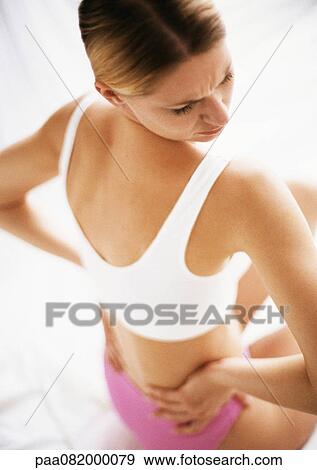 Woman in underwear holding waist, looking over shoulder, rear view. View Large Photo Image Stock Photo - Woman in underwear holding waist, looking over shoulder, rear view.. Fotosearch