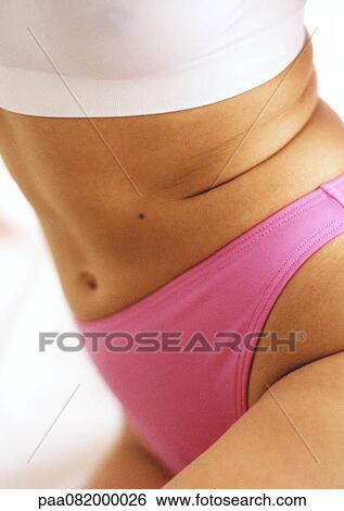 Woman in underwear, side view of mid-section, close-up View Large Photo Image Stock Photograph - Woman in underwear, side view of mid-section, close-up. Fotosearch