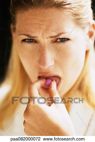 Woman putting pill in mouth, looking at camera. View Large Photo Image Stock Image - Woman putting pill in mouth, looking at camera.. Fotosearch