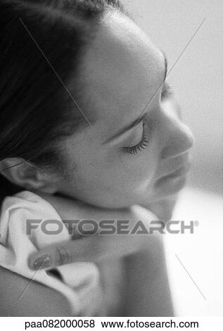 Woman resting head on hand, side view, close-up, B&W. View Large Photo Image Stock Photo - Woman resting head on hand, side view, close-up, B&W.. Fotosearch