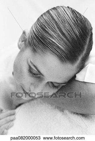 Woman with eyes closed and head tilted down, B&W. View Large Photo Image Stock Image - Woman with eyes closed and head tilted down, B&W.. Fotosearch
