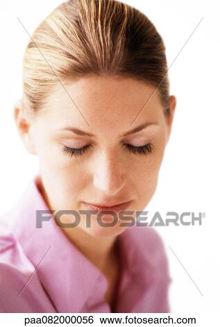 Stock Photograph - Woman with eyes closed, portrait.. Fotosearch