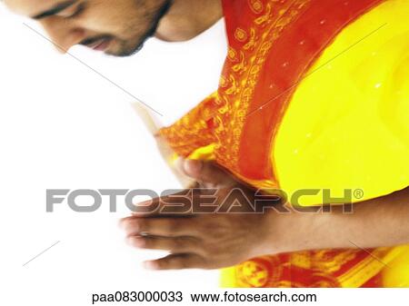 Close up of Hindu man praying. View Large Photo Image Stock Image - Close up of Hindu man praying.. Fotosearch