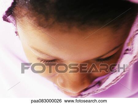 Close up of woman's face praying, high angle view View Large Photo Image Stock Photograph - Close up of woman's face praying, high angle view. Fotosearch