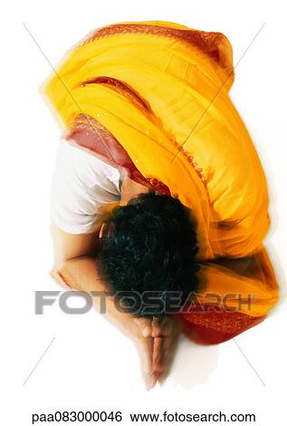 Hindu man praying, high angle view View Large Photo Image Stock Photograph - Hindu man praying, high angle view. Fotosearch
