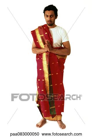 Hindu man standing and praying, full length View Large Photo Image Stock Image - Hindu man standing and praying, full length. Fotosearch