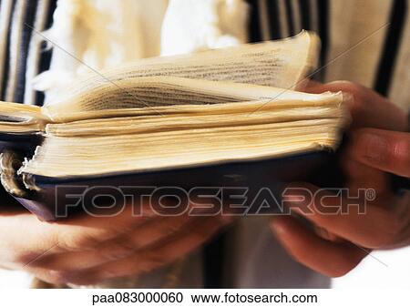 Jewish man's hands holding Torah, close-up View Large Photo Image Stock Image - Jewish man's hands holding Torah, close-up. Fotosearch
