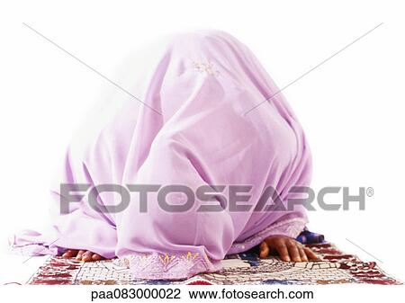 Muslim woman bowing in prayer. View Large Photo Image Stock Image - Muslim woman bowing in prayer.. Fotosearch