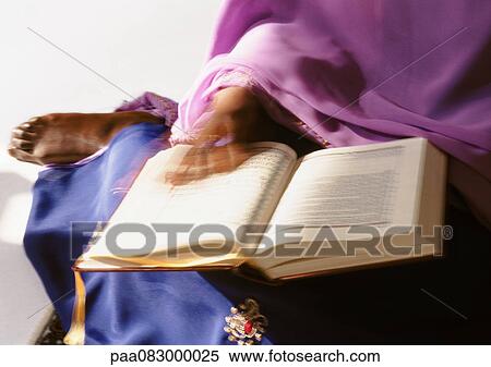 Muslim woman with manuscript, blurry. View Large Photo Image Stock Photography - Muslim woman with manuscript, blurry.. Fotosearch