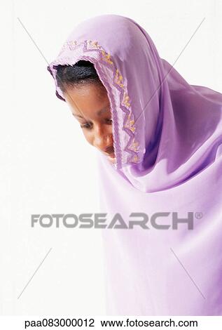 Woman wearing religious veil, looking down View Large Photo Image Stock Image - Woman wearing religious veil, looking down. Fotosearch