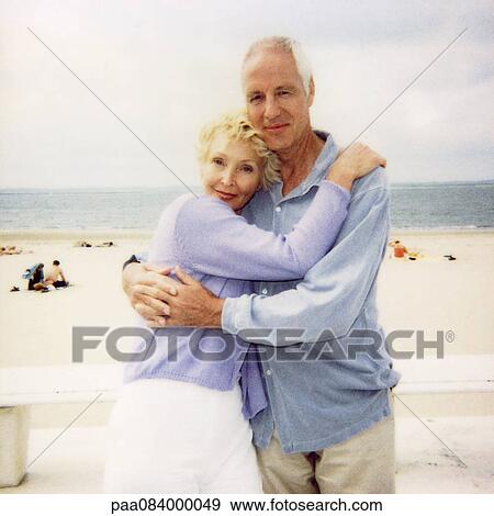 Mature couple embracing at the beach, portrait, soft focus View Large Photo Image Stock Photo - Mature couple embracing at the beach, portrait, soft focus. Fotosearch