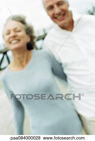 Mature couple smiling on beach, blurred portrait. View Large Photo Image Stock Photo - Mature couple smiling on beach, blurred portrait.. Fotosearch
