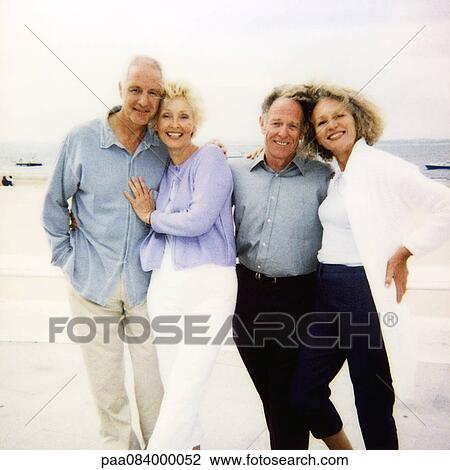 Mature couples on beach, portrait. View Large Photo Image Stock Image - Mature couples on beach, portrait.. Fotosearch