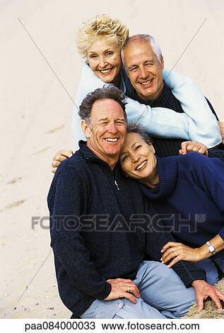 Mature couples on the beach, portrait. View Large Photo Image Stock Image - Mature couples on the beach, portrait.. Fotosearch
