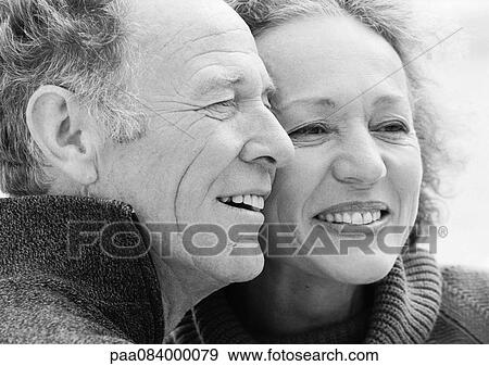 Stock Photo - Mature man and woman smiling, close up, portrait, B&W.. Fotosearch
