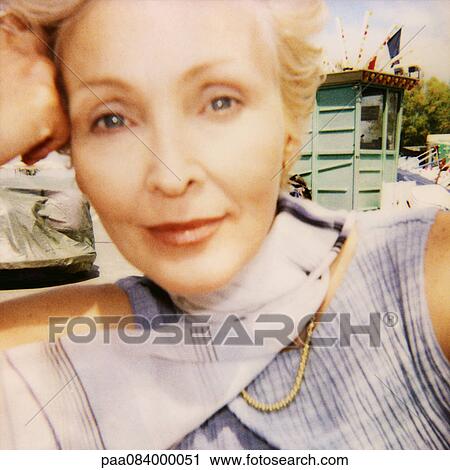 Mature woman, hand to head, close up, portrait, soft focus View Large Photo Image Stock Image - Mature woman, hand to head, close up, portrait, soft focus. Fotosearch