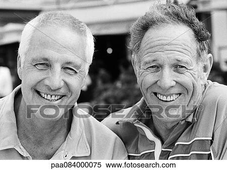 Stock Photography - Two mature men smiling, close-up, portrait, B&W.. Fotosearch