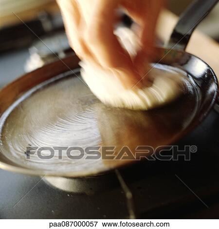 Close-up of a pan being oiled, blurry. View Large Photo Image Stock Photo - Close-up of a pan being oiled, blurry.. Fotosearch