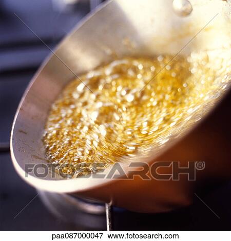 Close-up of caramel bubbling in pan View Large Photo Image Stock Photo - Close-up of caramel bubbling in pan. Fotosearch
