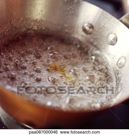 Close-up of caramel bubbling in pan View Large Photo Image Stock Photograph - Close-up of caramel bubbling in pan. Fotosearch