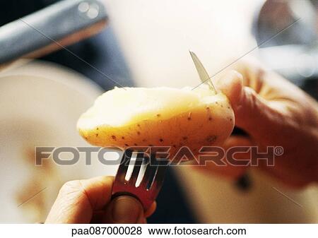 Close-up of hands peeling a potato. View Large Photo Image Stock Photo - Close-up of hands peeling a potato.. Fotosearch