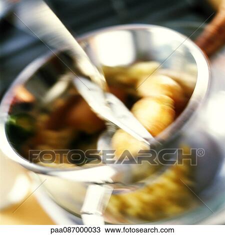Close-up of potatoes being mashed in foodmill, blurry. View Large Photo Image Stock Image - Close-up of potatoes being mashed in foodmill, blurry.. Fotosearch