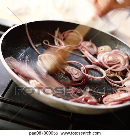 Close-up of red onions being sauted in a pan. View Large Photo Image Stock Photography - Close-up of red onions being sauted in a pan.. Fotosearch