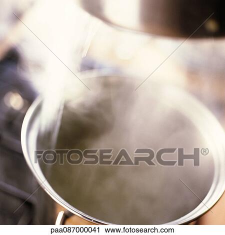 Close-up of steaming pot on stove. View Large Photo Image Stock Image - Close-up of steaming pot on stove.. Fotosearch