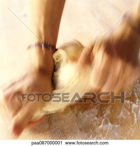 Hands kneading dough, blurred motion View Large Photo Image Stock Image - Hands kneading dough, blurred motion. Fotosearch