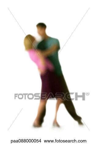 Picture - Silhouette of couple dancing, on white background, defocused. Fotosearch