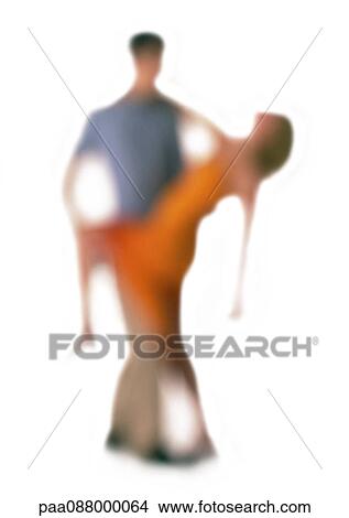 Picture - Silhouette of couple dancing, on white background, defocused. Fotosearch