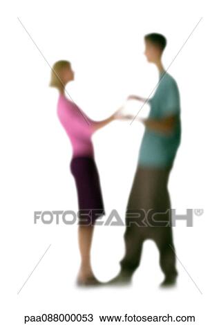 Stock Image - Silhouette of couple dancing, on white background, defocused. Fotosearch