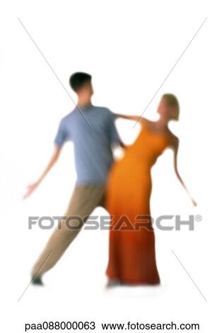 Stock Image - Silhouette of couple dancing, on white background, defocused. Fotosearch