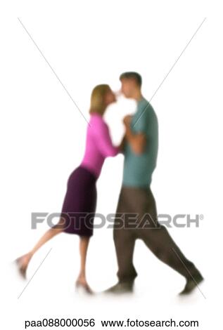 Stock Photograph - Silhouette of couple kissing, on white background, defocused. Fotosearch