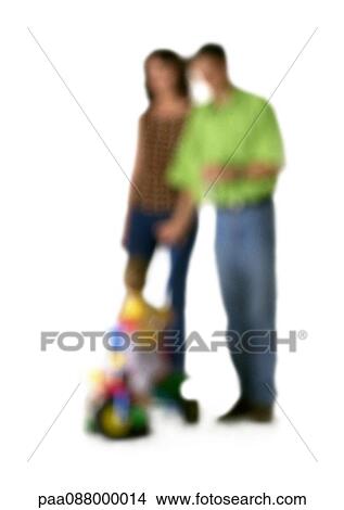 Picture - Silhouette of parents and child, on white background, defocused. Fotosearch