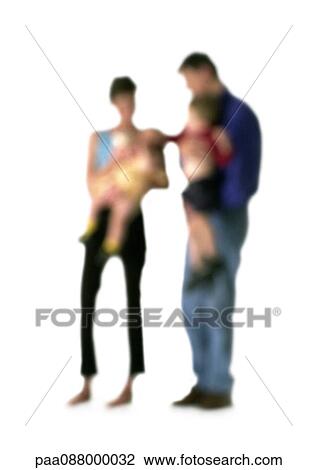Stock Image - Silhouette of parents holding children, on white background, defocused. Fotosearch