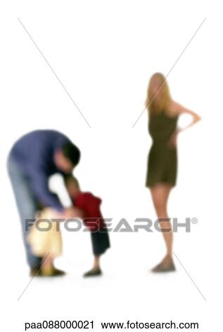 Stock Image - Silhouette of parents with two children, on white background, defocused. Fotosearch