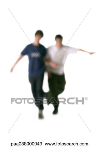Stock Photo - Silhouette of two men arm in arm, on white background, defocused. Fotosearch