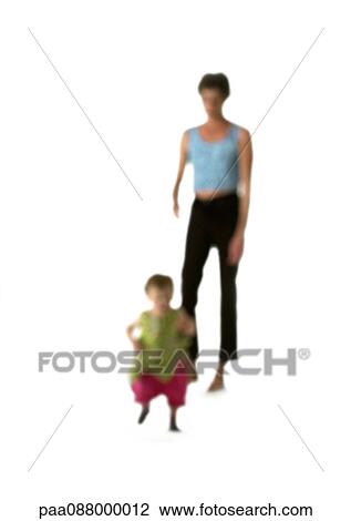 Stock Image - Silhouette of woman and child, on white background, defocused. Fotosearch