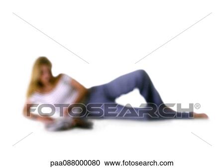 Stock Image - Silhouette of woman on side, on white background, defocused. Fotosearch