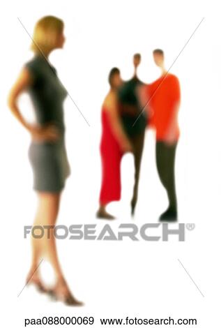 Stock Photo - Silhouette of woman standing apart from group of people, on white background, defocused. Fotosearch