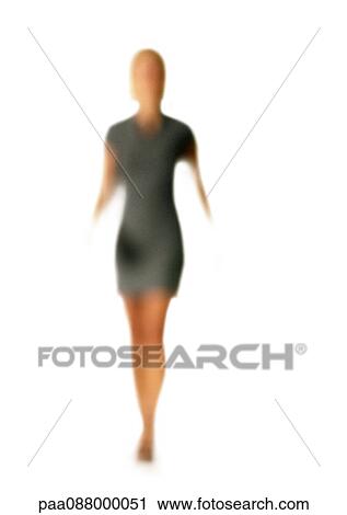 Stock Image - Silhouette of woman walking, on white background, defocused. Fotosearch